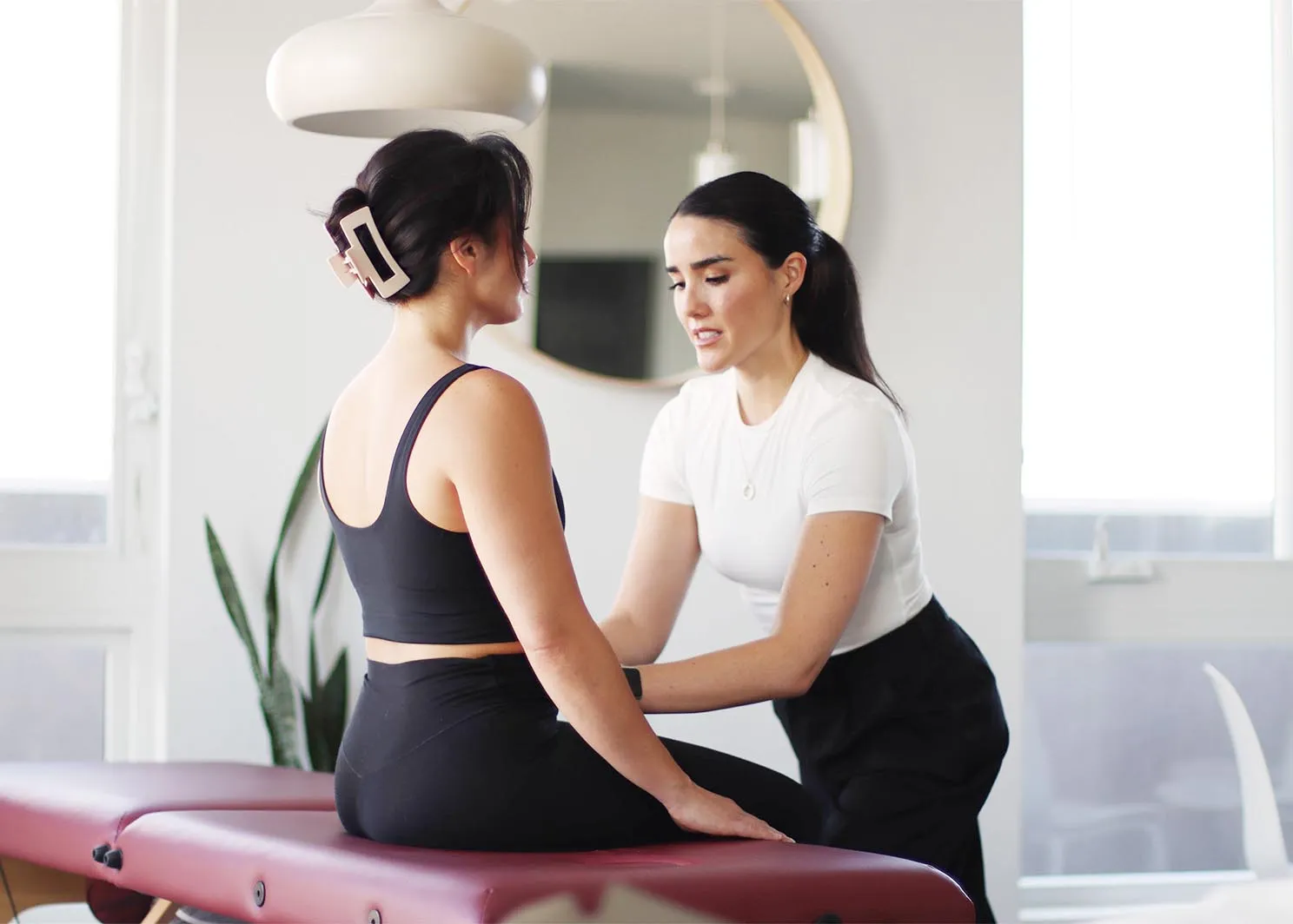 An image of Dr. Kylie helping on of her patients and assessing their pelvic health